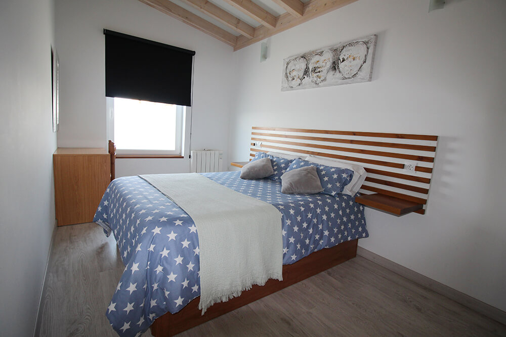 Bungalow bedroom with blue bedding