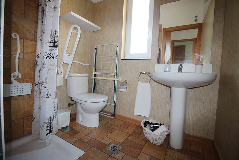 Accessible bathroom with grab bars in a bungalow