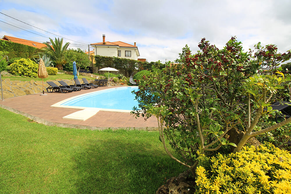 Resort pool surrounded by garden